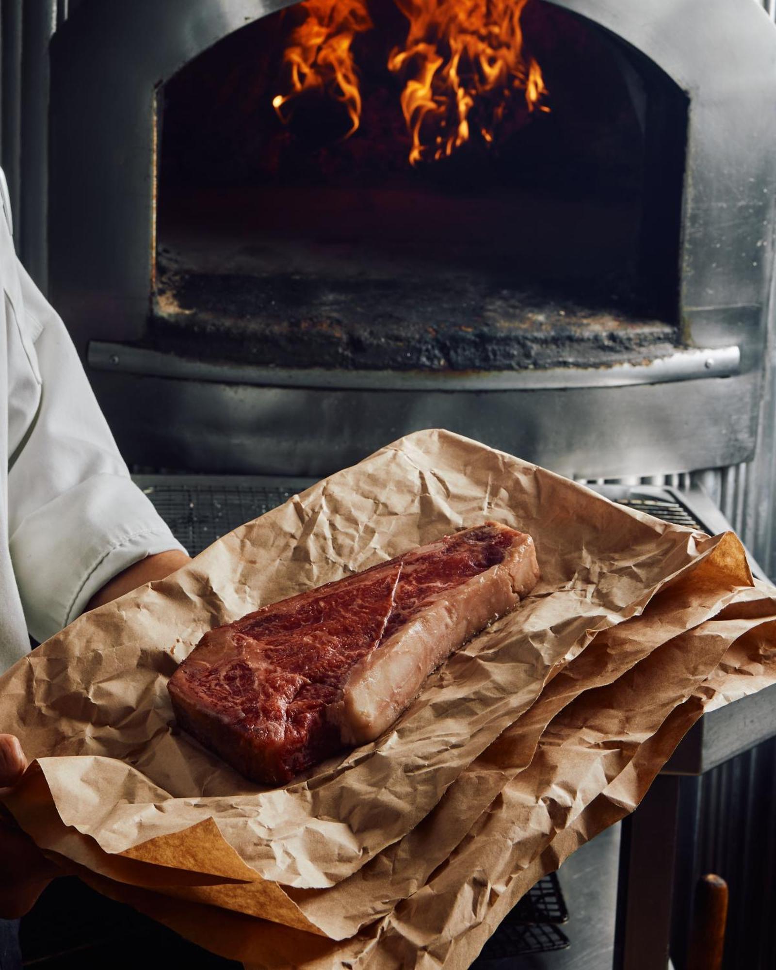 Park Hyatt Melbourne Hotel Ngoại thất bức ảnh A steak being removed from a wood-fired oven